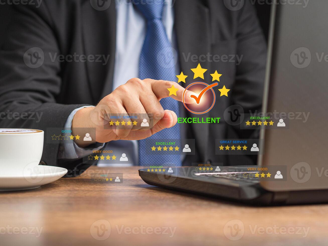 Businessman in a suit touching on the five-star icon to give a rating of excellent photo