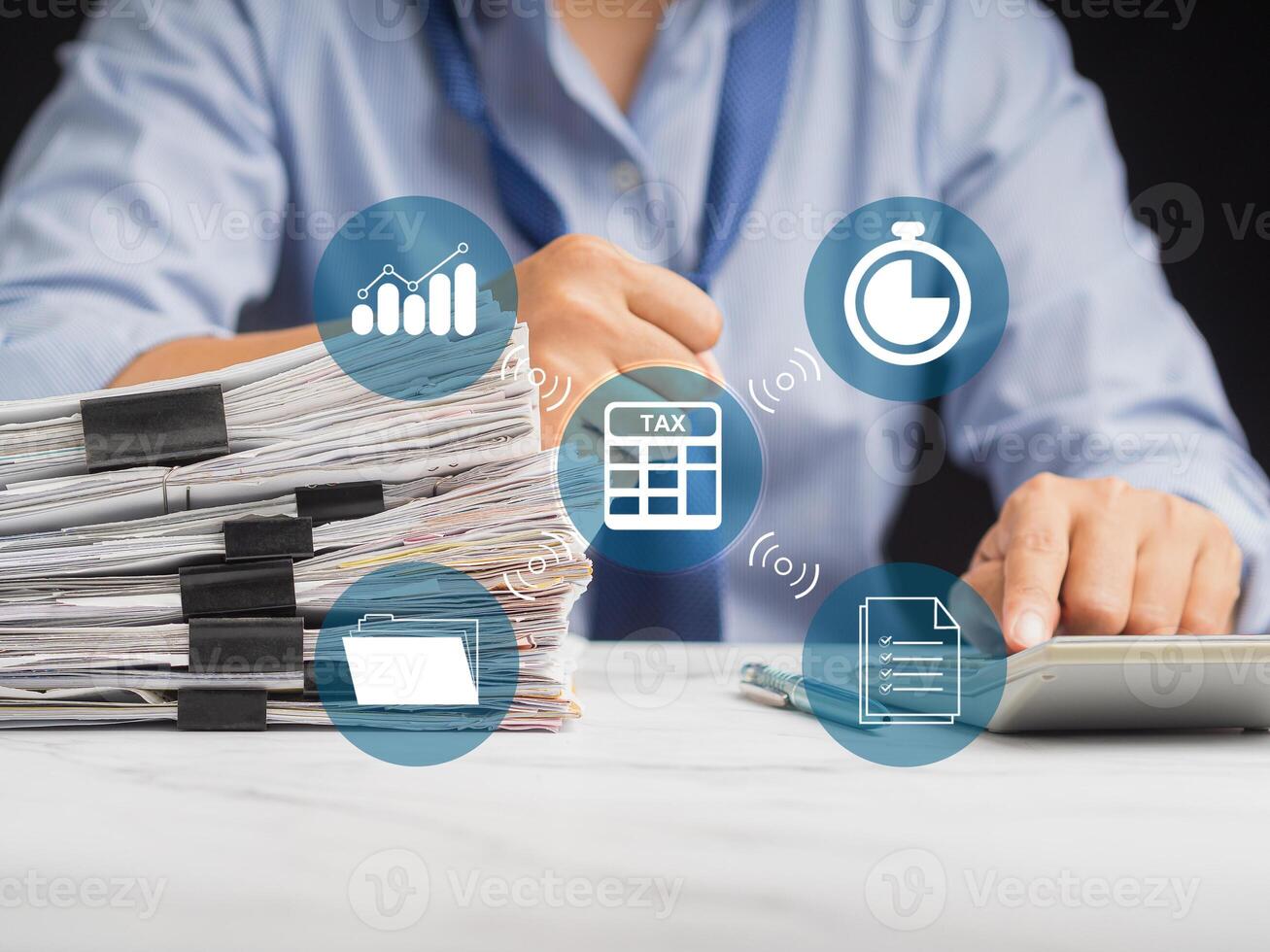 Man using a calculator to calculate tax. An individual income tax payment form photo