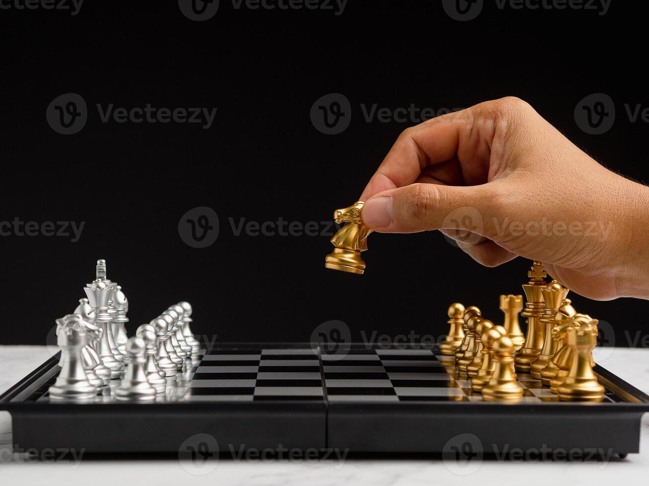 Businessman playing with chess game. Business strategy ideas and investment photo