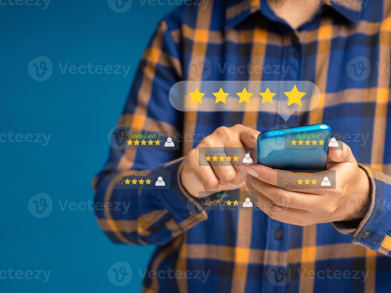 Man using a smartphone give the five-star icon a rating of very impressed for service. Customer service and satisfaction surveys concept photo