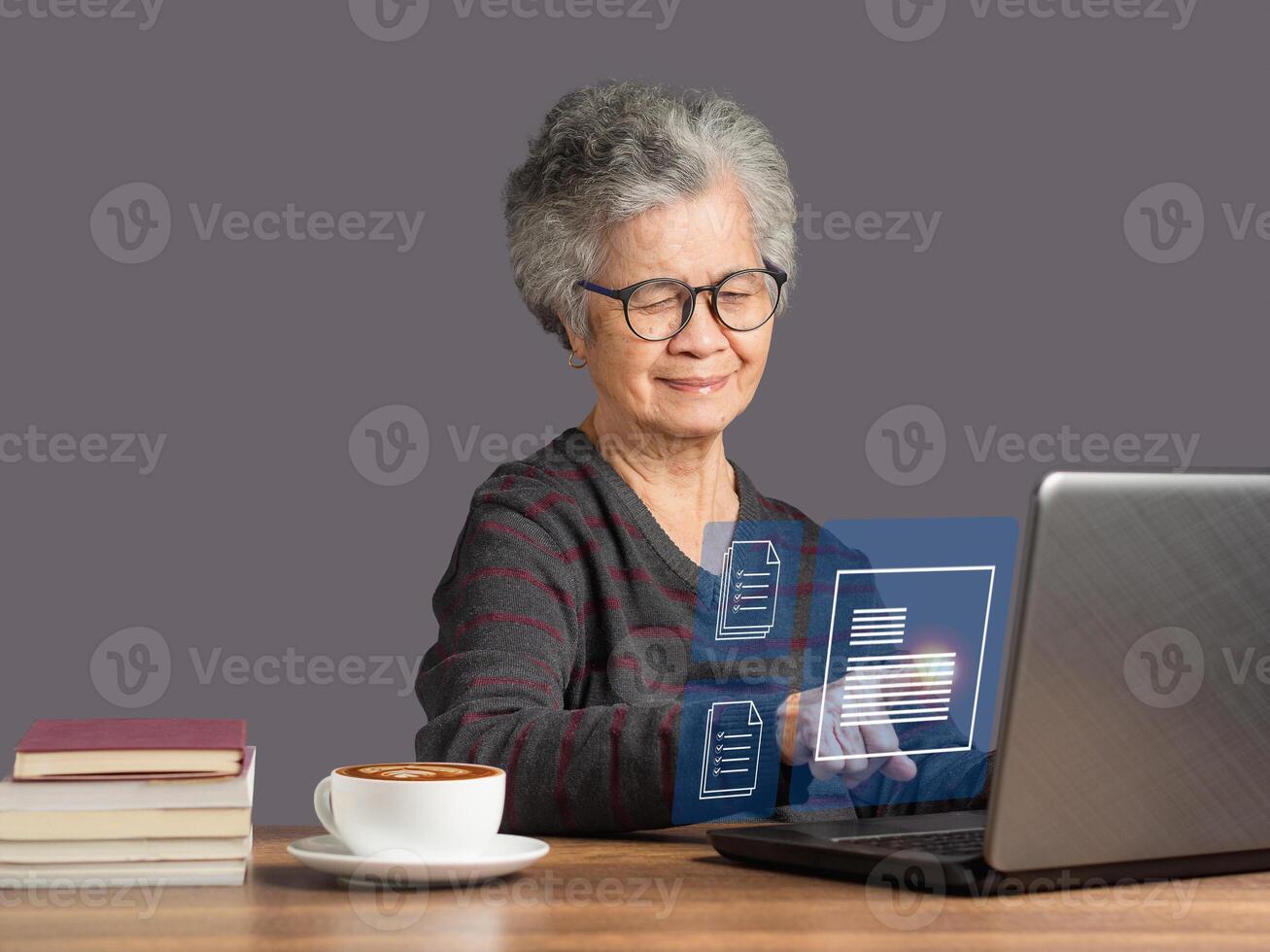 Senior woman reading digital documents on a virtual screen photo