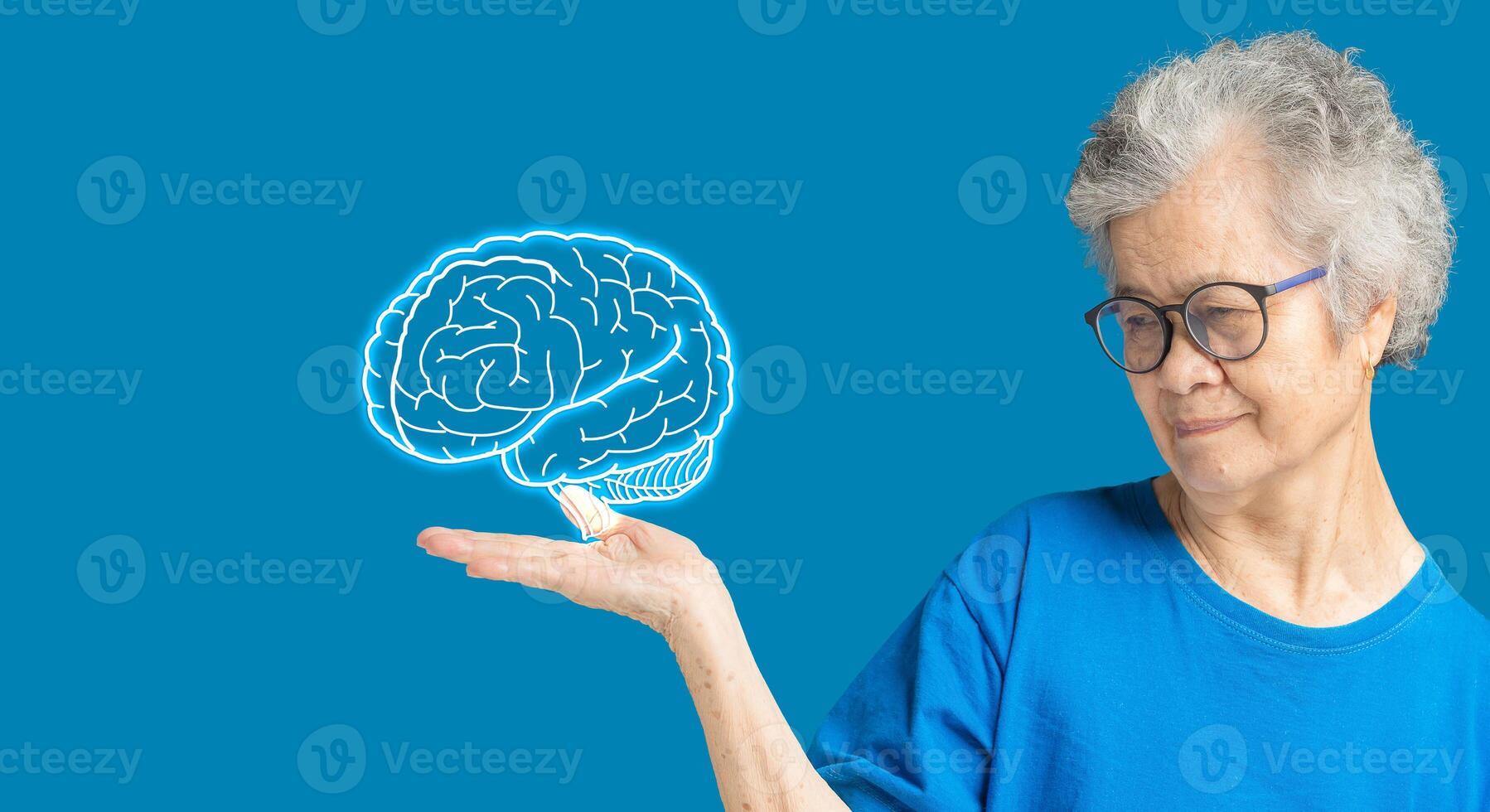 Brain on the palm a senior woman. Dementia in people. Memory loss photo