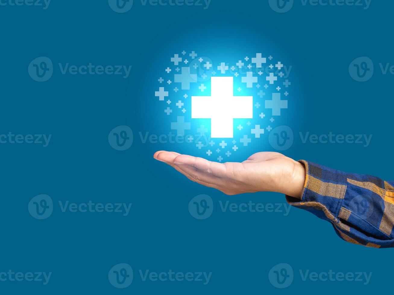Virtual medical icons on the palm businessman against a blue background photo