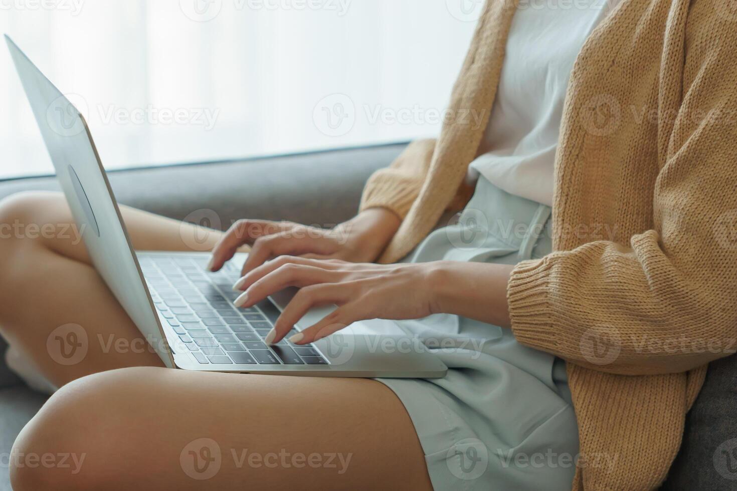 Business woman working from home. work online on laptop. Asian businesswoman working on sofa online business with social distancing laptop online meeting photo