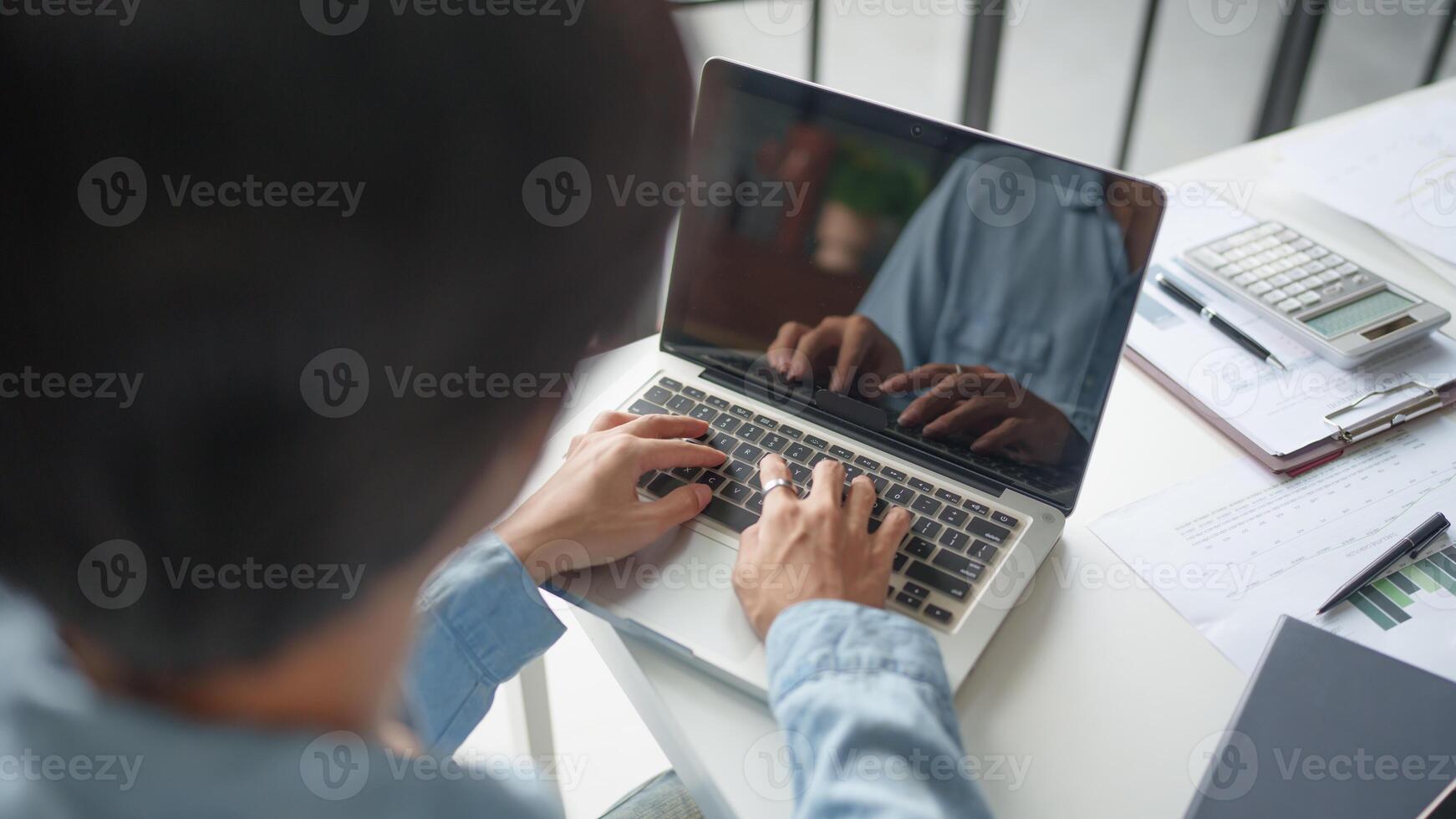 Business man working with laptop Hands typing keyboard. Professional investor working new start up project. business planning in office. Technology business. photo