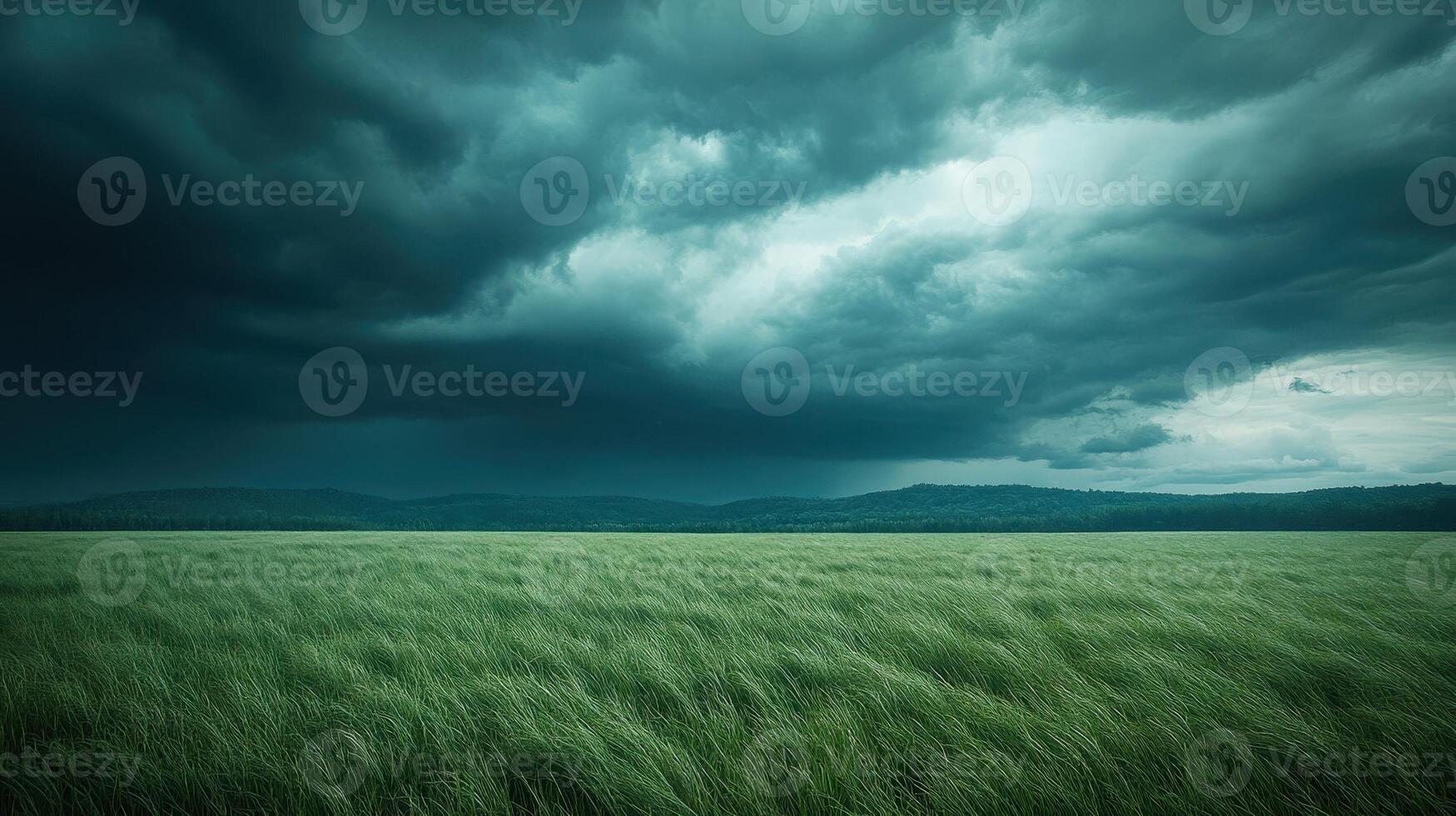 Storm Clouds Over Green Field. Dramatic sky with dark clouds over a green field. Concepts of weather, nature, environment, climate change. photo