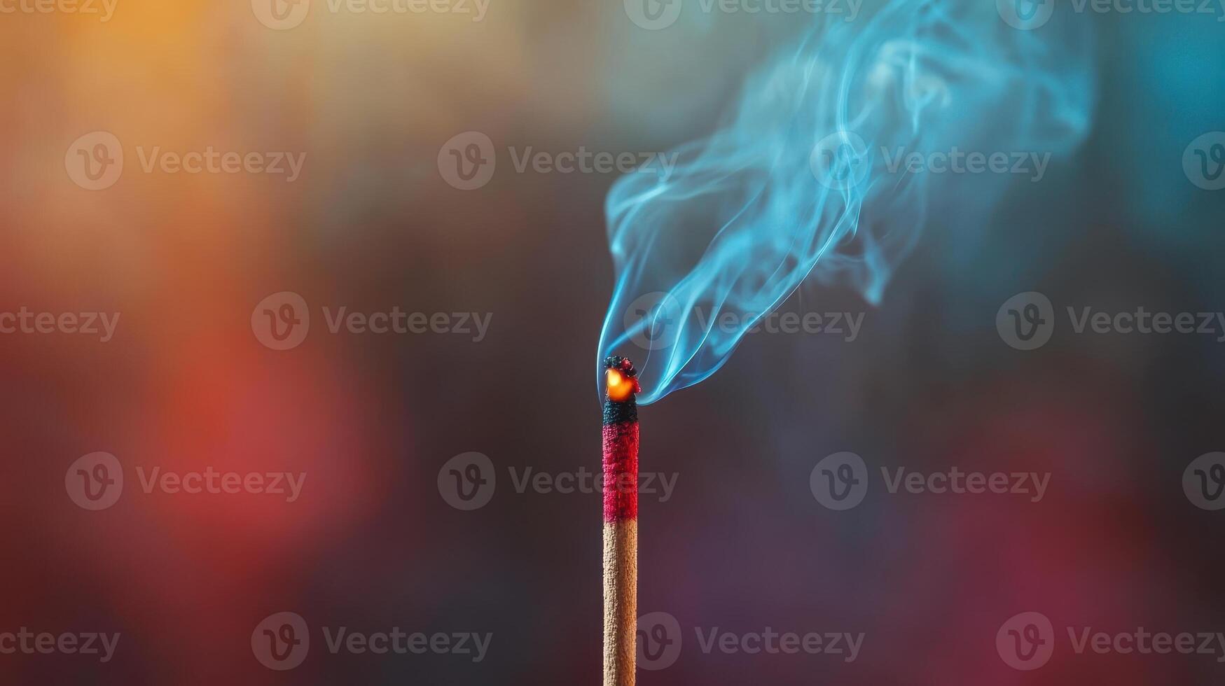 Incense stick burning with blue smoke, aromatherapy and relaxation concept photo
