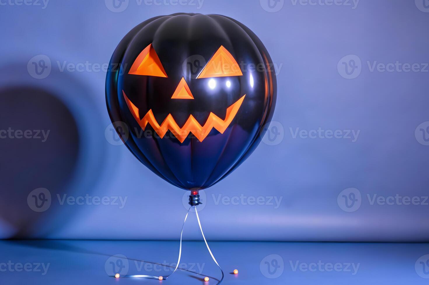 A halloween balloon with a jack o lantern face photo