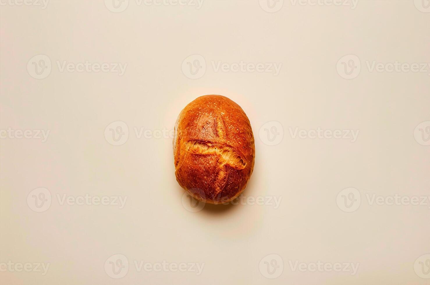 Minimalistic loaf of white bread with crust, top view photo