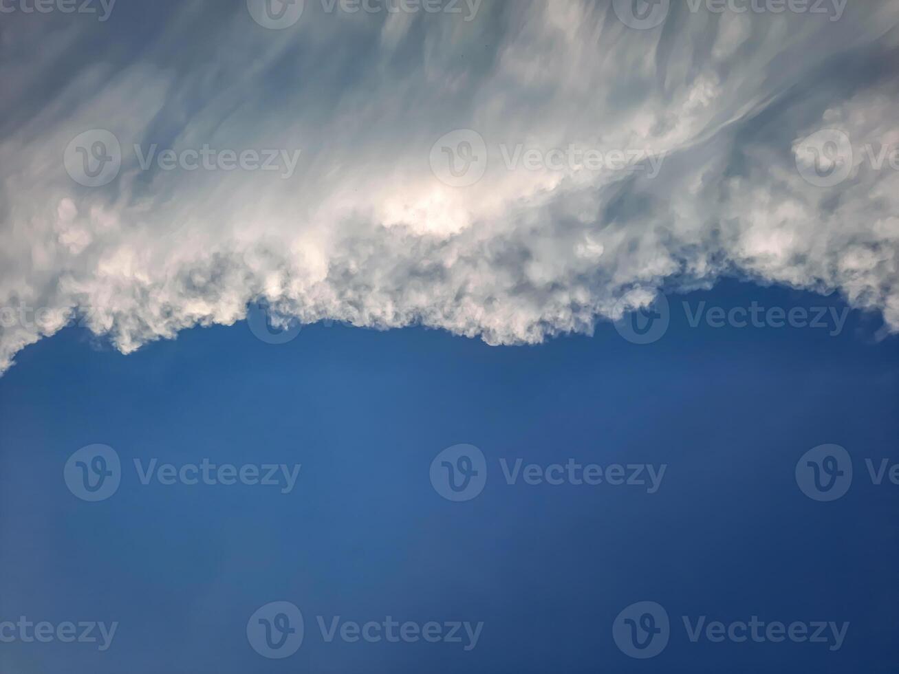 Clouds - during the day, the blue sky is partially covered by thick white clouds, which are expected to become black clouds soon and severe weather is expected. photo