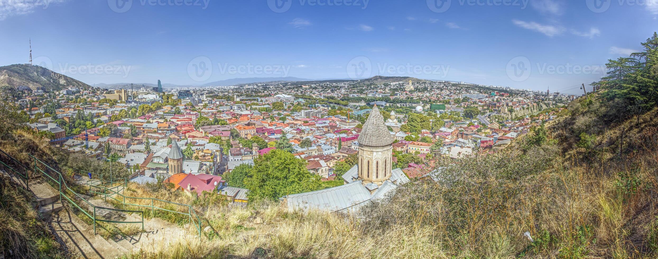 Panoramic daytime view over the city of Tbilisi, Georgia, with colorful rooftops and landmarks photo