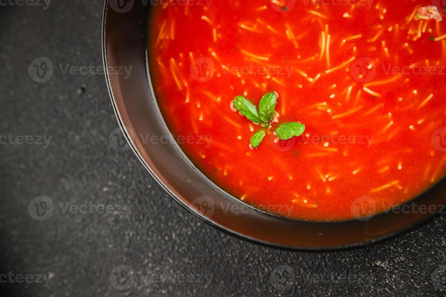 Tomato soup with vermicelli gazpacho first course dish fresh delicious gourmet food background on the table rustic food top view copy space keto and paleo diet Vegetarian and vegan food photo
