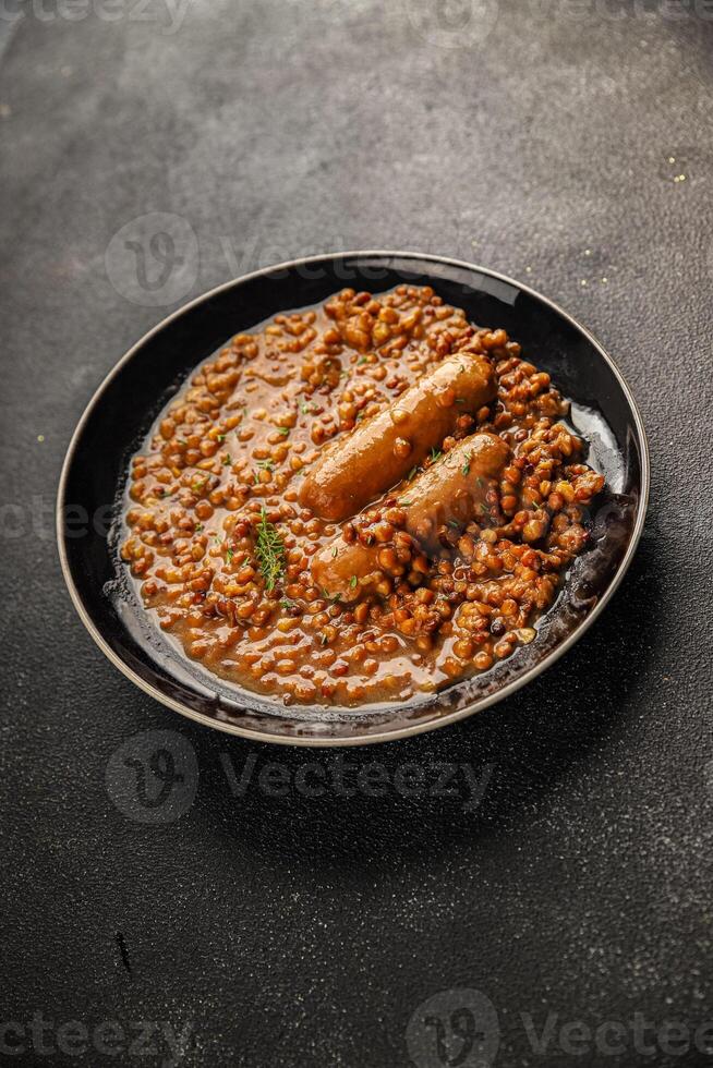 Lentil with sausage tasty food dish second course fresh gourmet food background on the table rustic food top view copy space top view photo