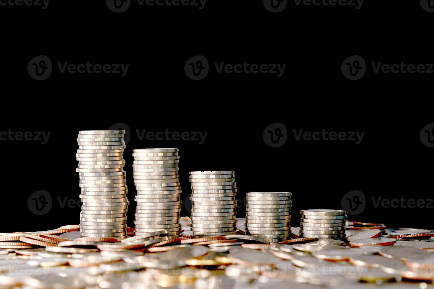 Stacks of Silver Coins on Black Background Representing Financial Growth and Investment Opportunities photo