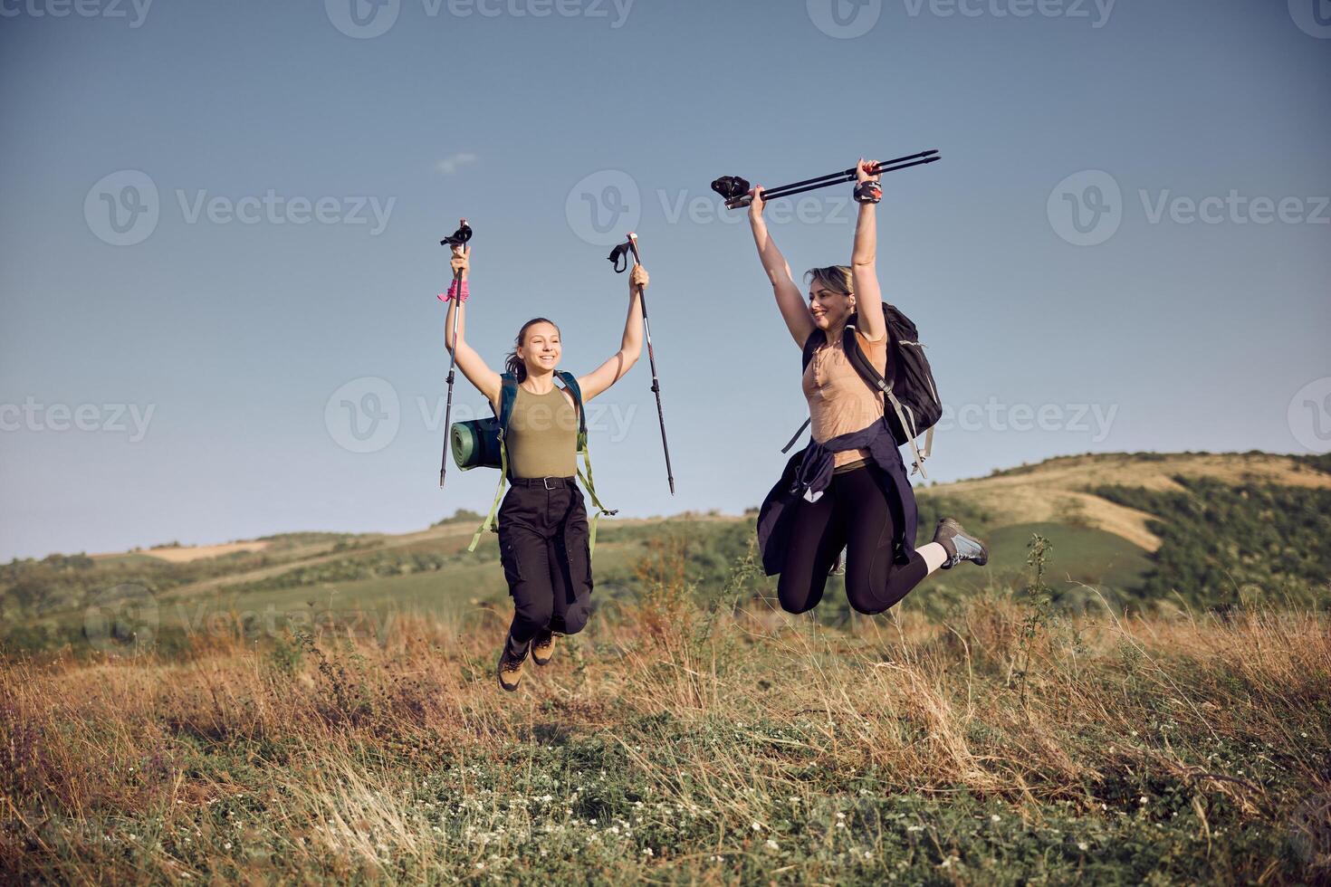 Mother And Daughter Celebrating After Getting On Top Of The Mountain photo