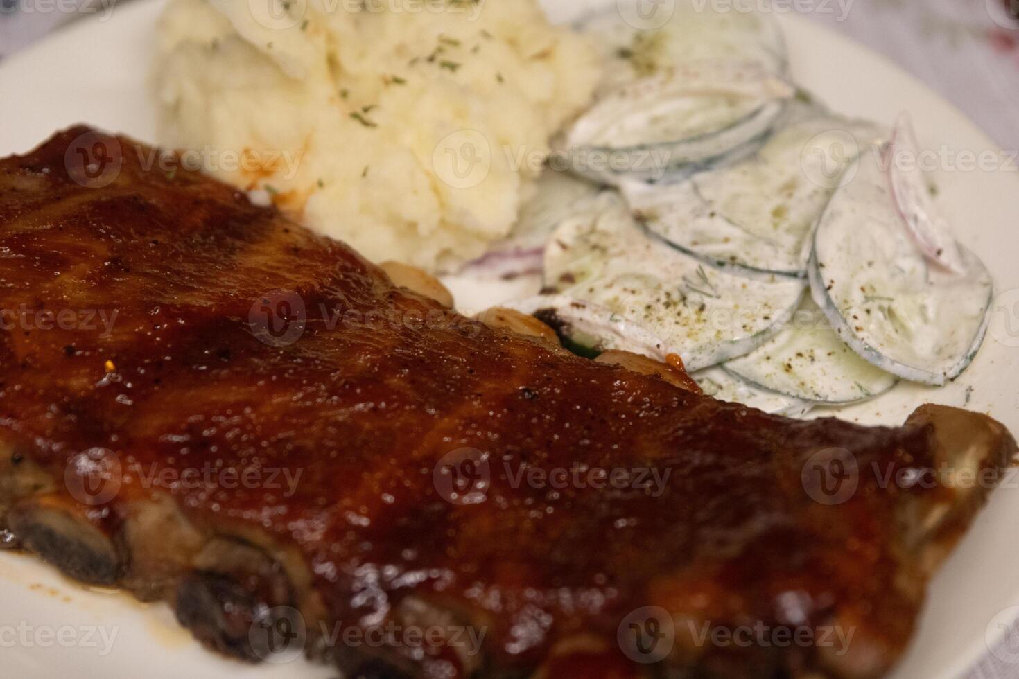 BBQ Ribs with Mashed Potatoes with cucumber salad photo