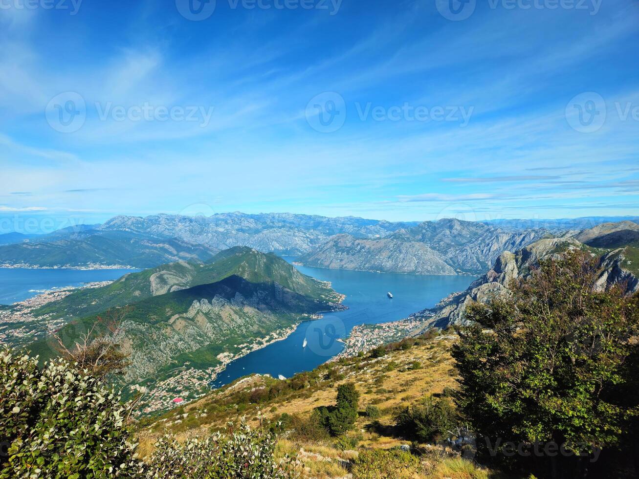 Arial view of The Bay of Kotor. Beautiful Kotor Bay in September. Full top view boka kotorska bay panorama from the mountain serpentine above. High mountains in Montenegro. Tivat, Kotor, Cetinje photo