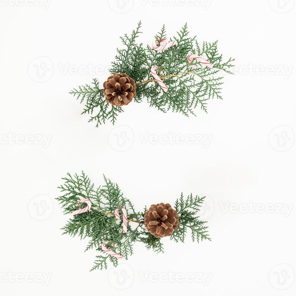 Christmas composition with tree branches on white background. Flat lay, top view photo