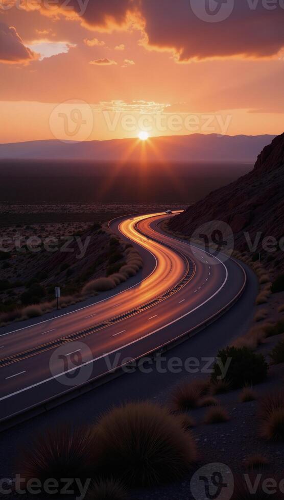 Stunning photograph of curved highway at sunset in the desert landscape photo