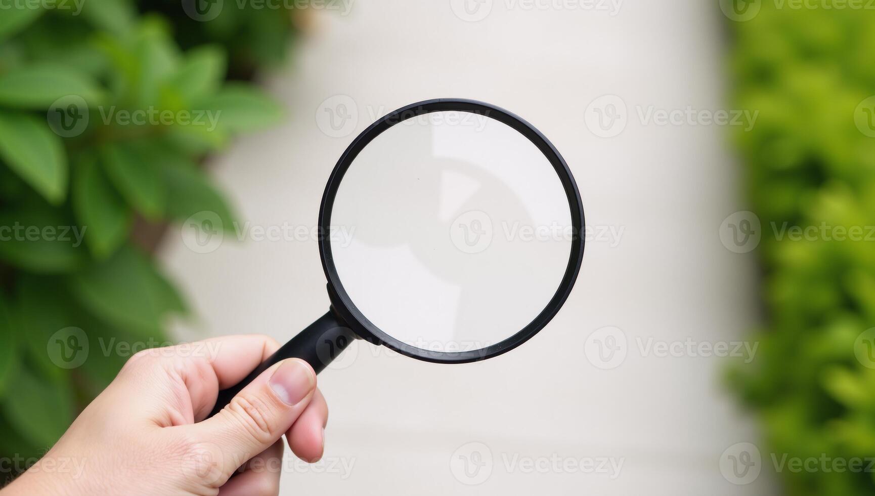 Hand checks for clean outdoor air using magnifying glass safe from pollutants dust PM 2 photo