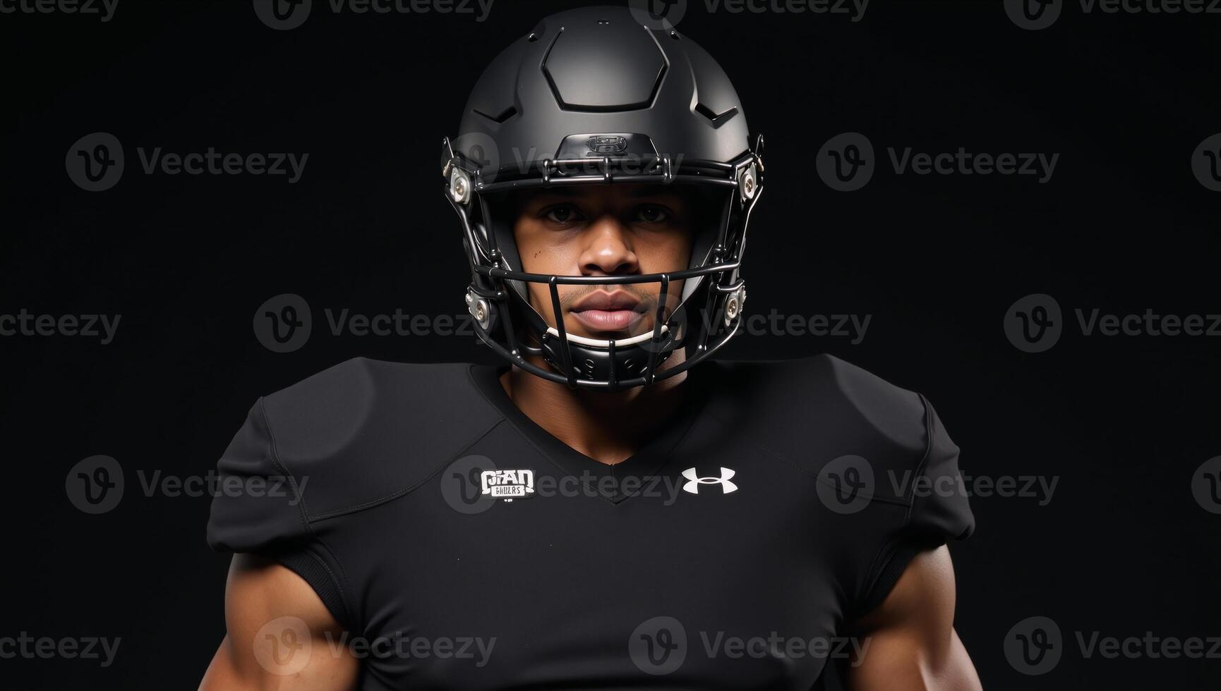 The image depicts a football player wearing allblack gear uniform helmet and face mask photo