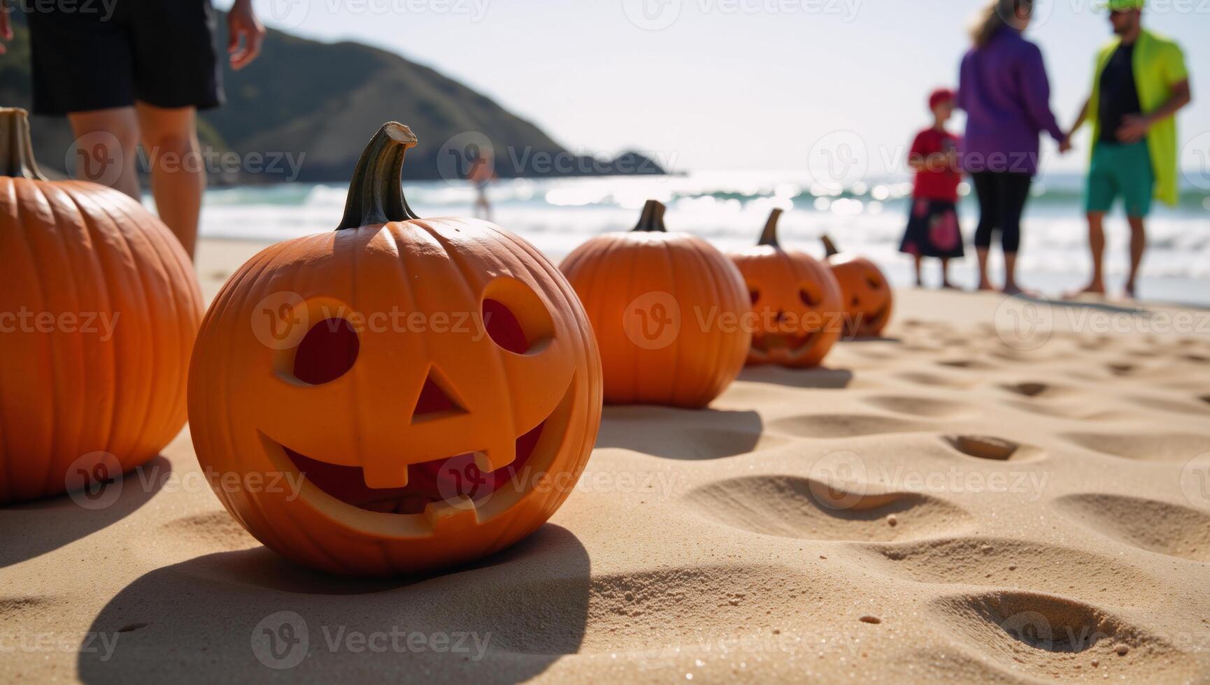 A festive autumn beach scene with pumpkins and Jackolanterns at a Halloween party by the shoreline featuring an iconic Jack o lantern amidst rolling waves of the ocean in the distance photo