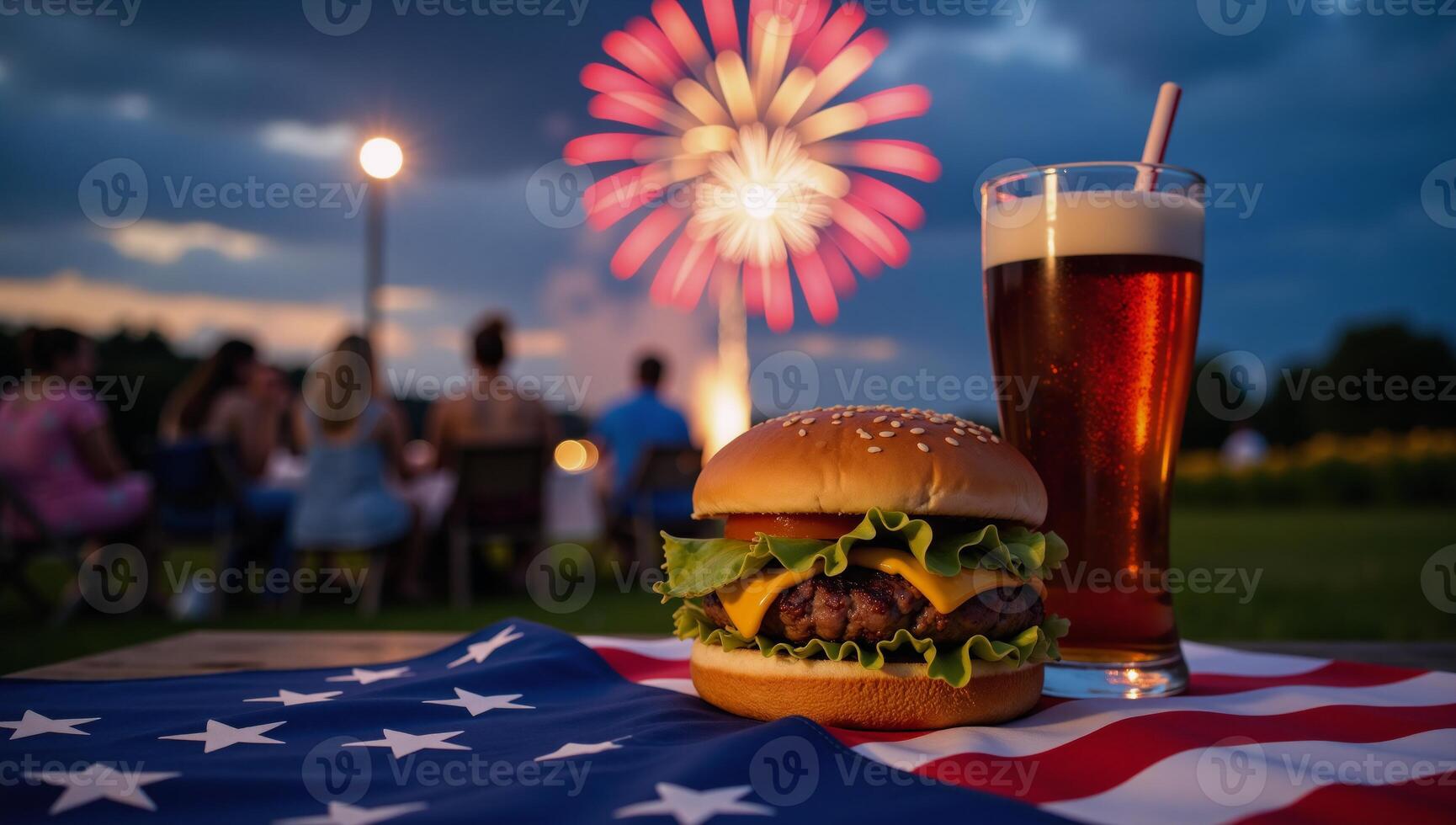 Burger and Cola on a Table with Fireworks over an American Flag Nightscape Scenic Backdrop photo