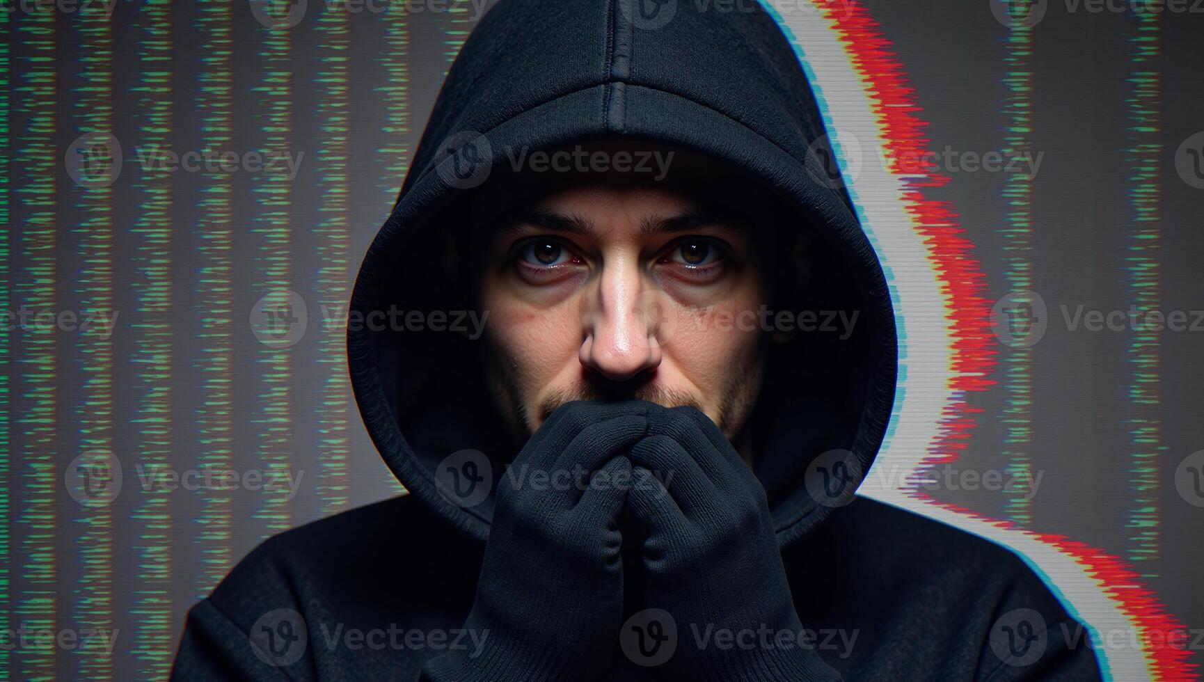 A hooded hacker amidst glitchy computer code glitch art photo