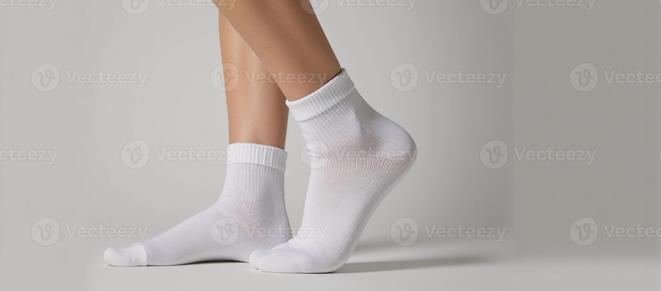 White double socks displayed against a backdrop photo