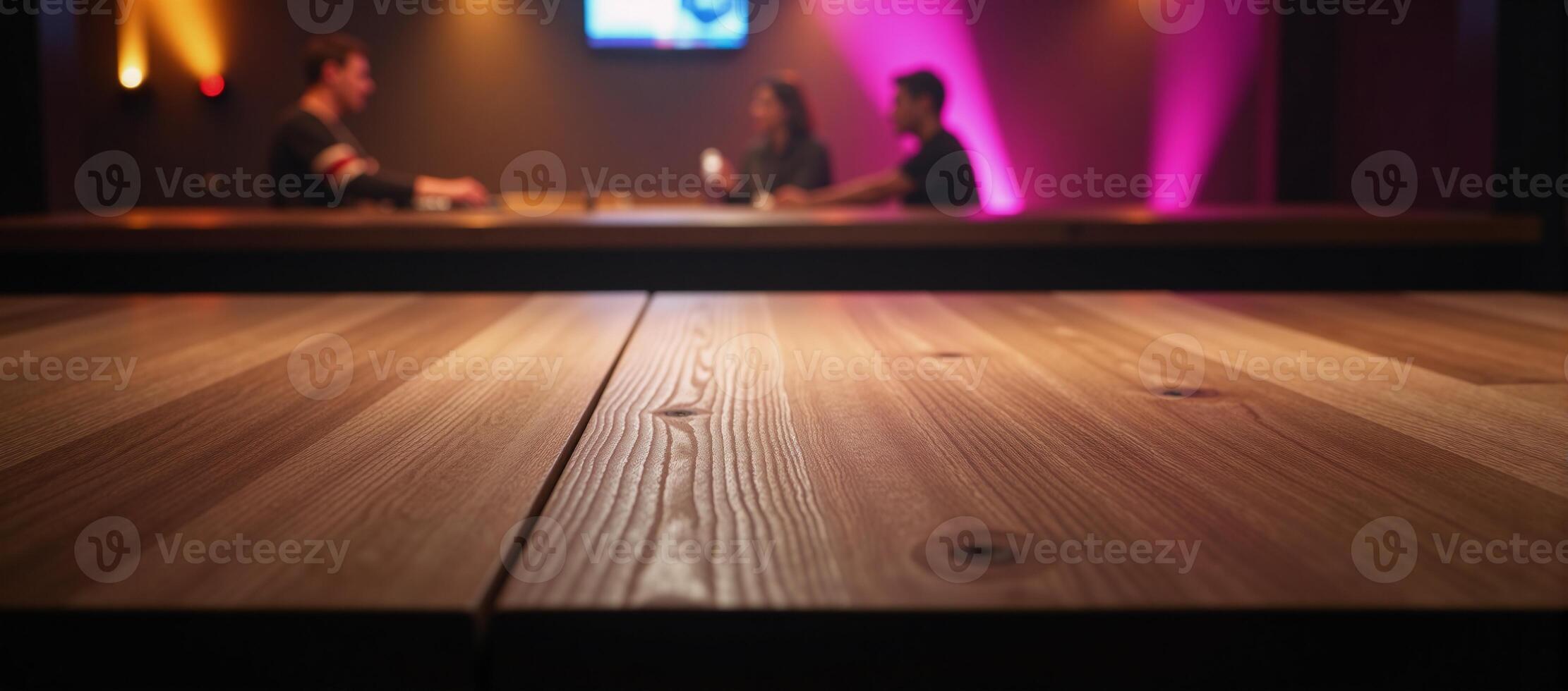 An empty wooden table stands amidst a blurred disco club backdrop for product demonstration photo