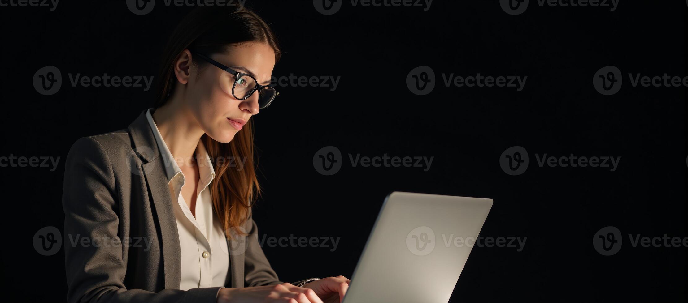 Businesswoman working on laptop photo