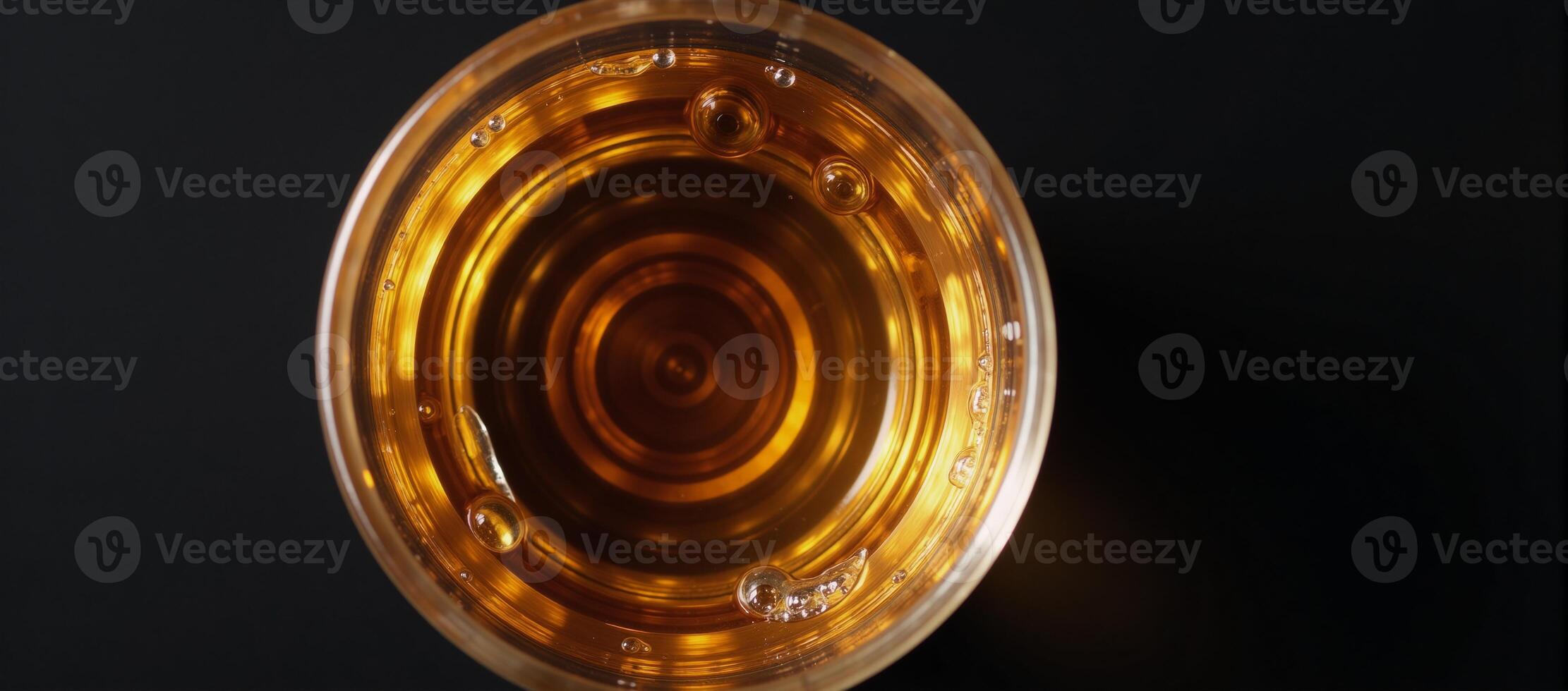 Topdown perspective of whiskey in a glass photo