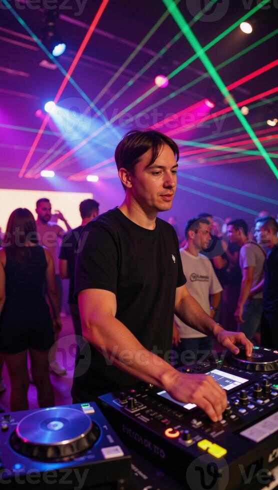 A DJ performing with laser effects at a nightclub setting photo