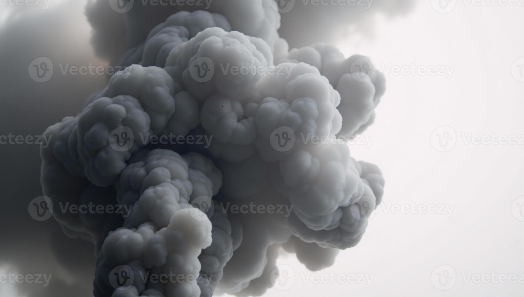 Dramatic billowing grey smoke contrasted against bright white backdrop creates an ethereal ambiance photo
