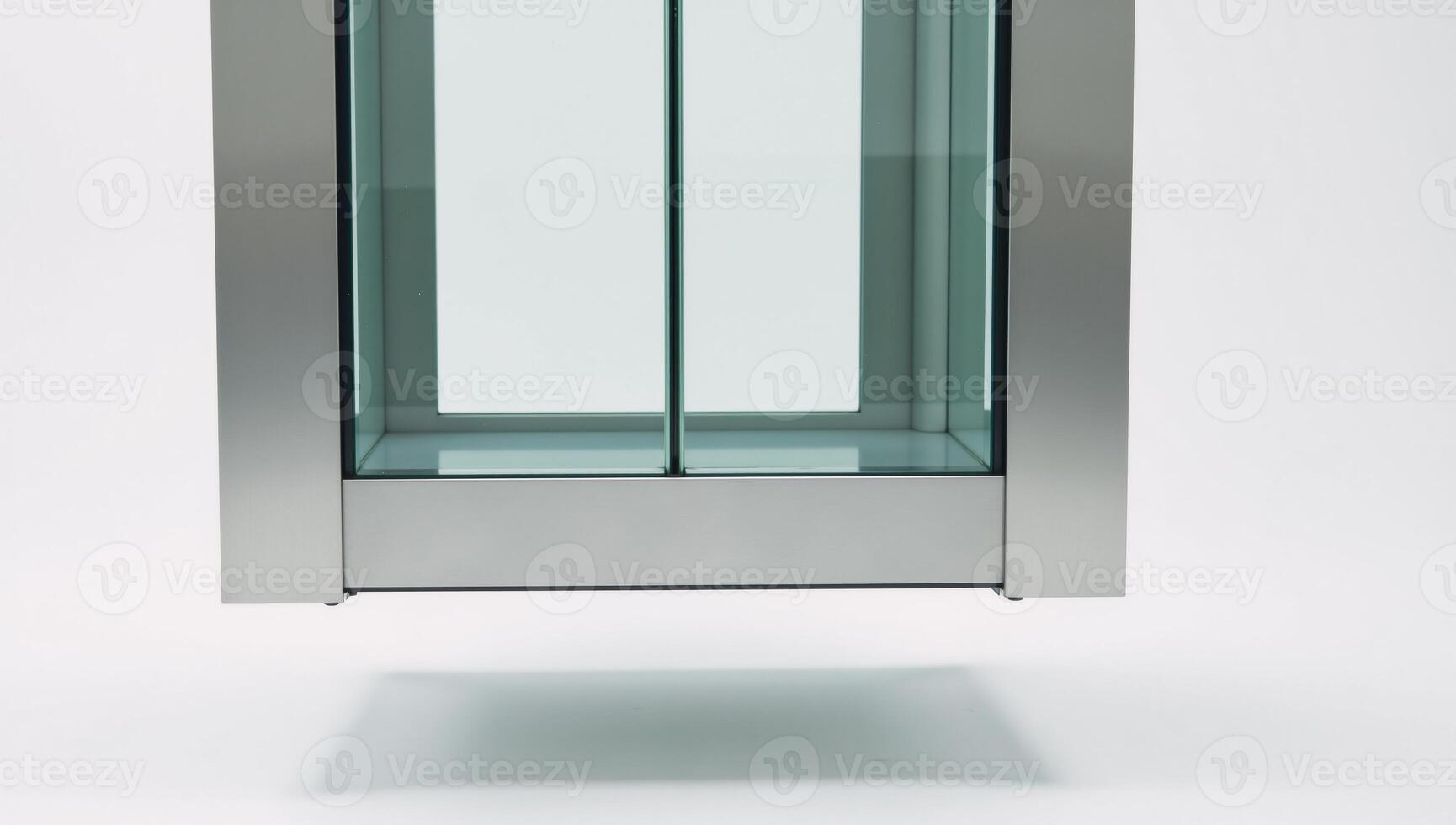 Sleek futuristic glass elevator against white background photo