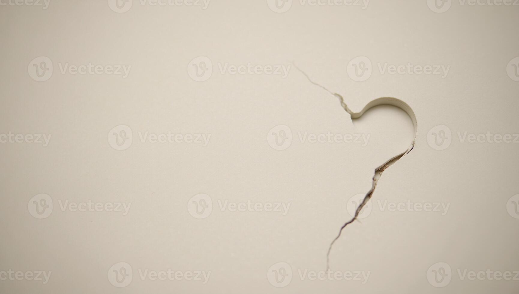 A heart with subtle cracks lies upon a peaceful backdrop signifying the beginning of emotional healing photo