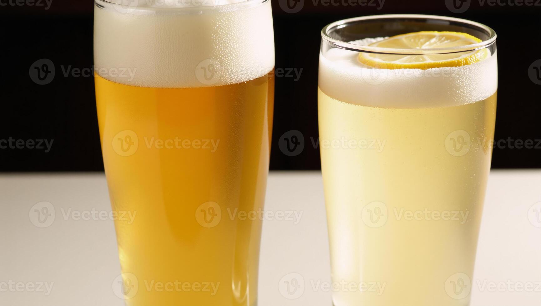 A Hefeweizen glass holds a hazy golden beer while another is garnished photo