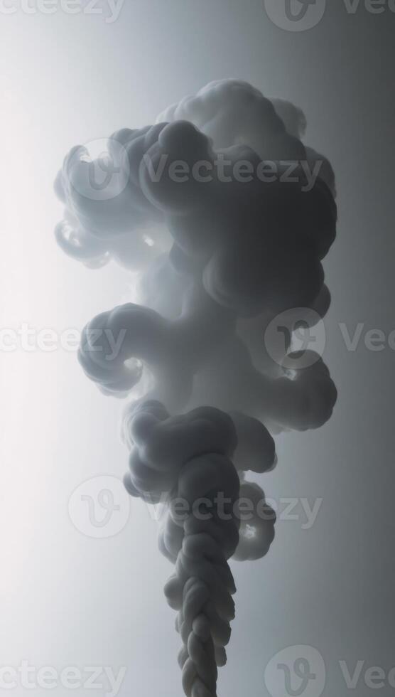 Dramatic billowing grey smoke contrasted against bright white backdrop creates an ethereal ambiance photo