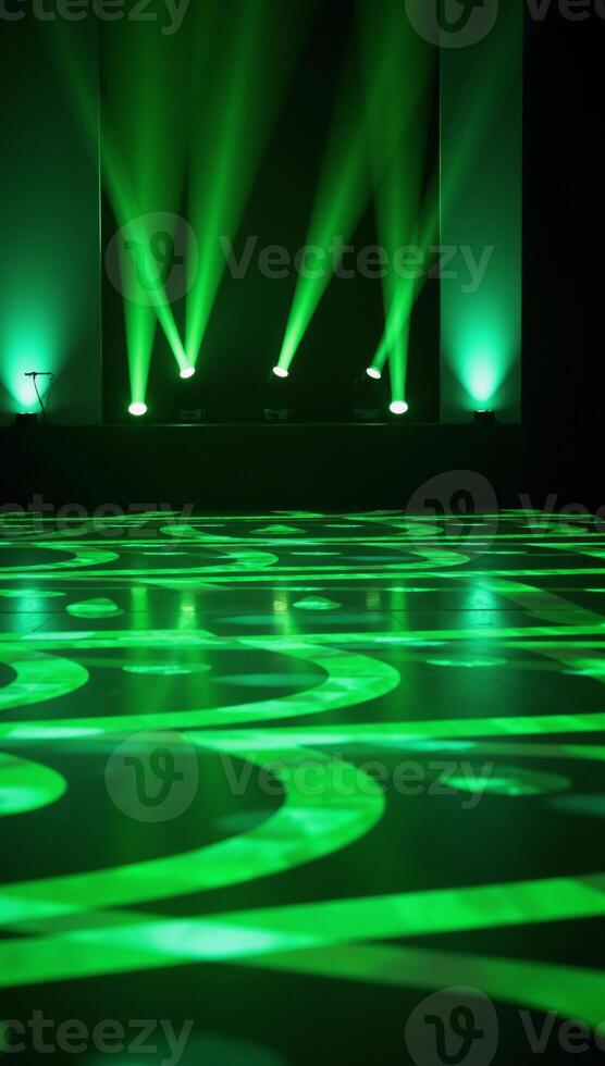 Vibrant dynamic stage setting with green lights and reflective geometric patterns for events or performances photo