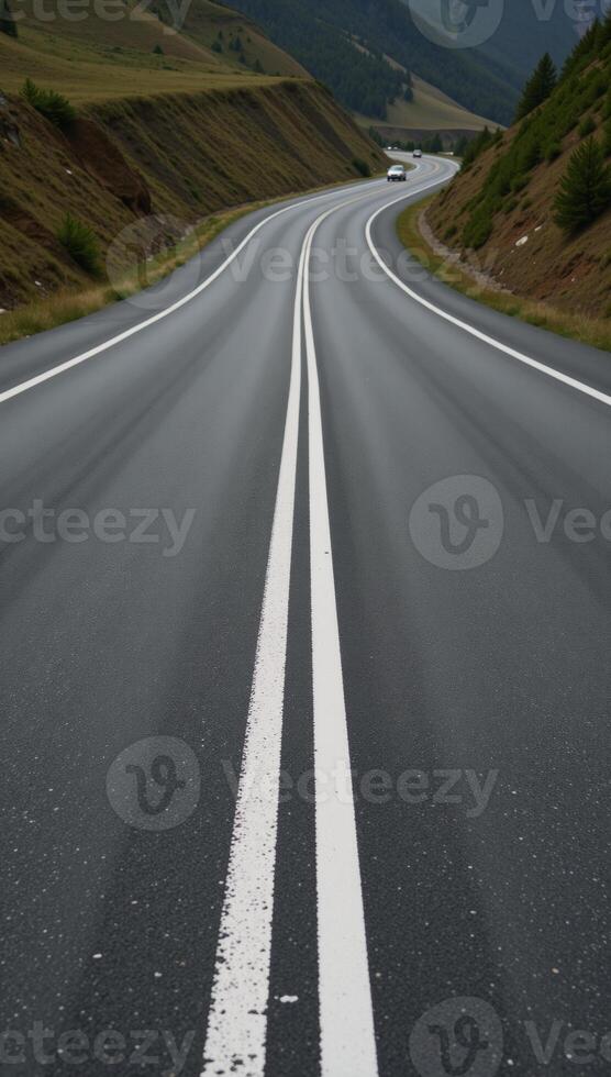 A roadway defined by painted white lines photo