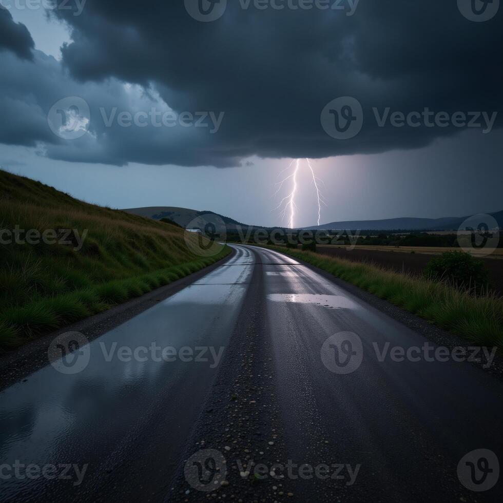 Stormtossed road with distant lightning and ominous clouds photo