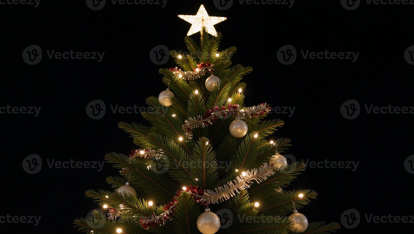 Twinkling Christmas tree with glowing star atop it photo