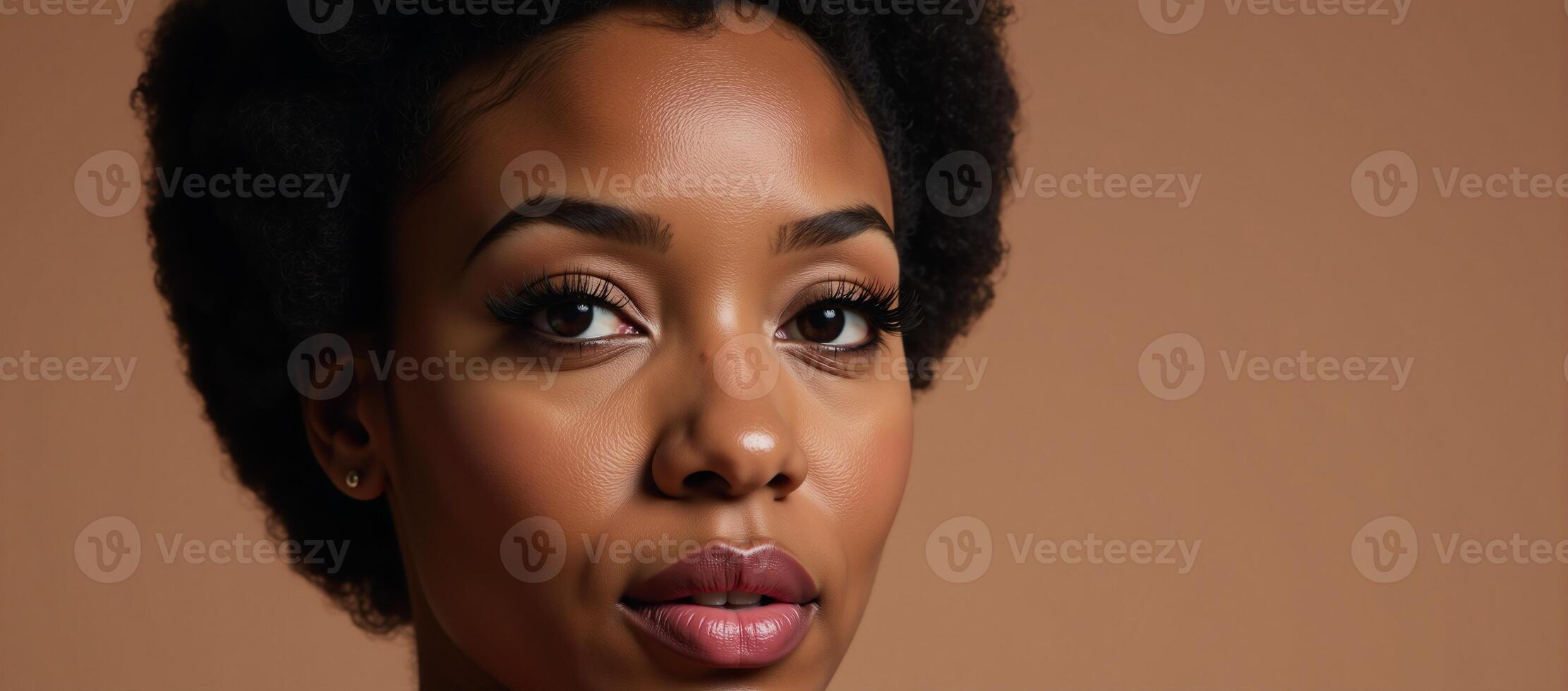 Closeup image of 1960s Afrocentric beauty with classic makeup and hair photo