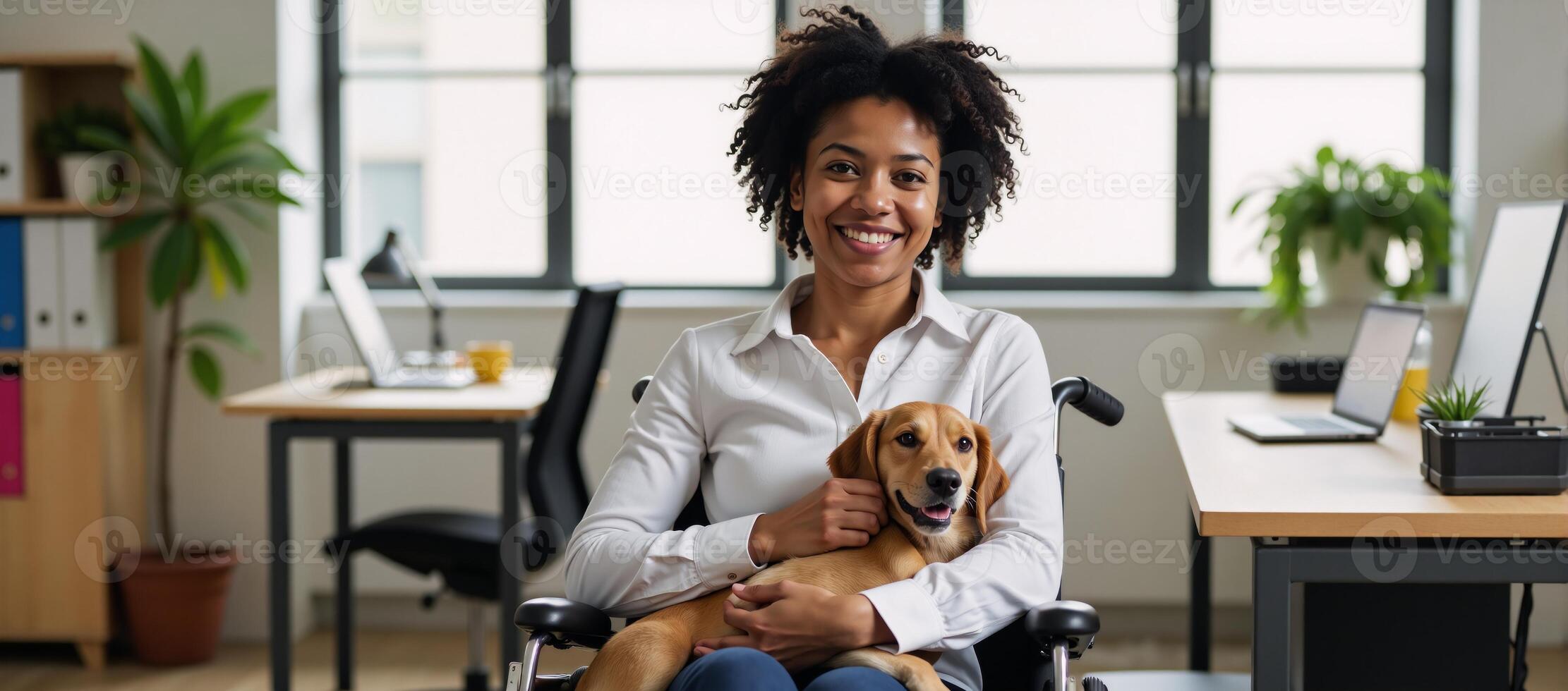 A disabled AfricanAmerican woman with a service dog cuddles at her desk on Bring Your Dog To Work Day photo
