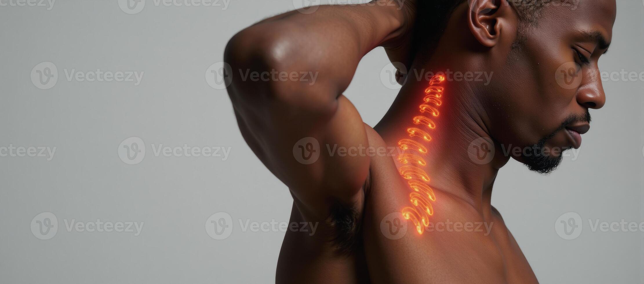 An AfricanAmerican man depicted with prominently displayed spine and radiating lines of visible pain photo