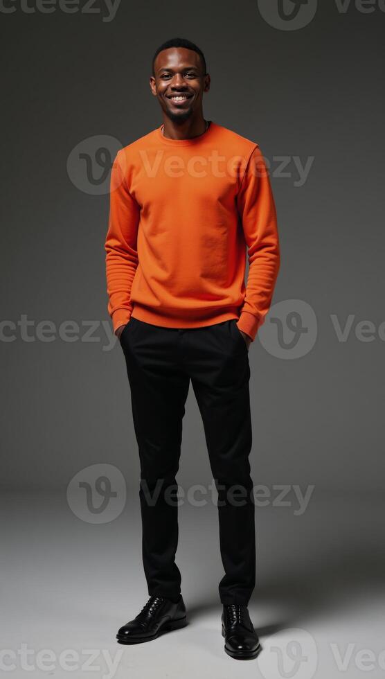 A radiant AfricanAmerican model poses confidently in an eyecatching orange sweater showcasing modern fashion and positivity against a minimalist black backdrop photo
