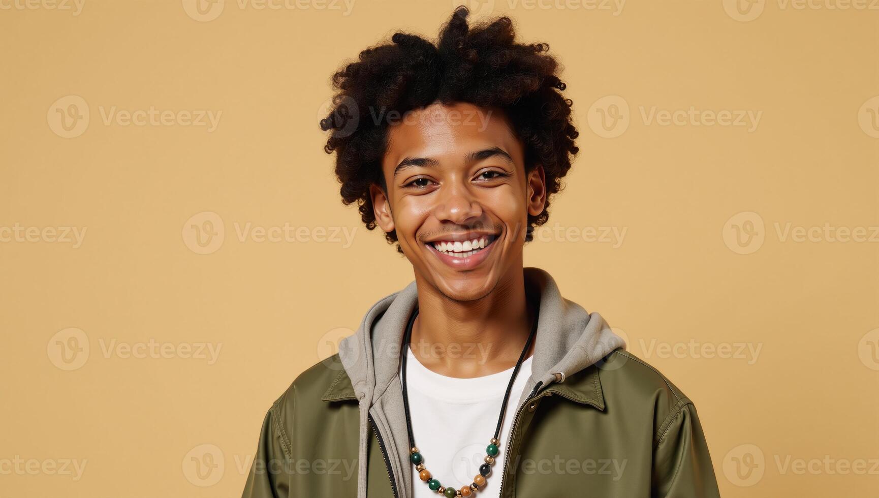 Isolated on a beige backdrop a happy Gen Z guy is captured midwink in playful style showcasing his cool ethnic features and perfectly aligned teeth photo