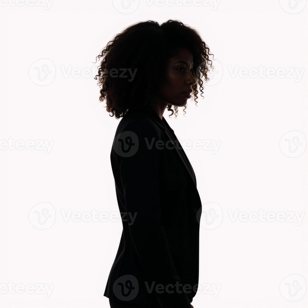 Profile portrait featuring a confident black woman with curly hair isolated against white background photo
