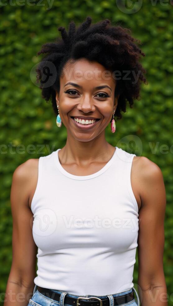 Portrait of a happy middleaged African American woman with quirky expressions against green background photo