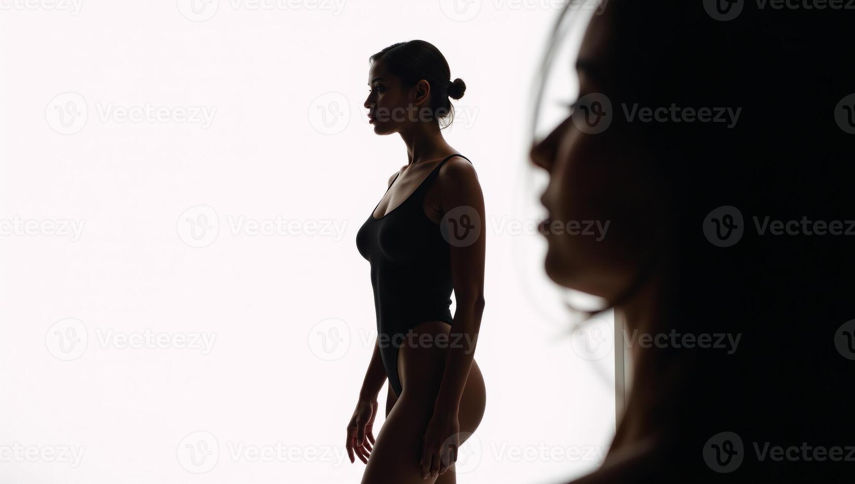 AfricanAmerican woman portrayed as a stylized silhouette on a white studio backdrop photo